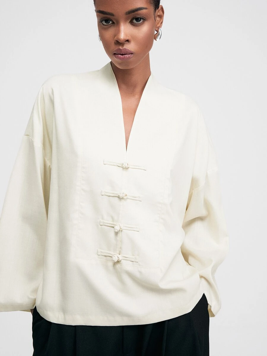 ATUI Studio Women's Solid Color V-Neck Frog Button Casual Loose Fashion Long Sleeve Shirt - Beige - View 1