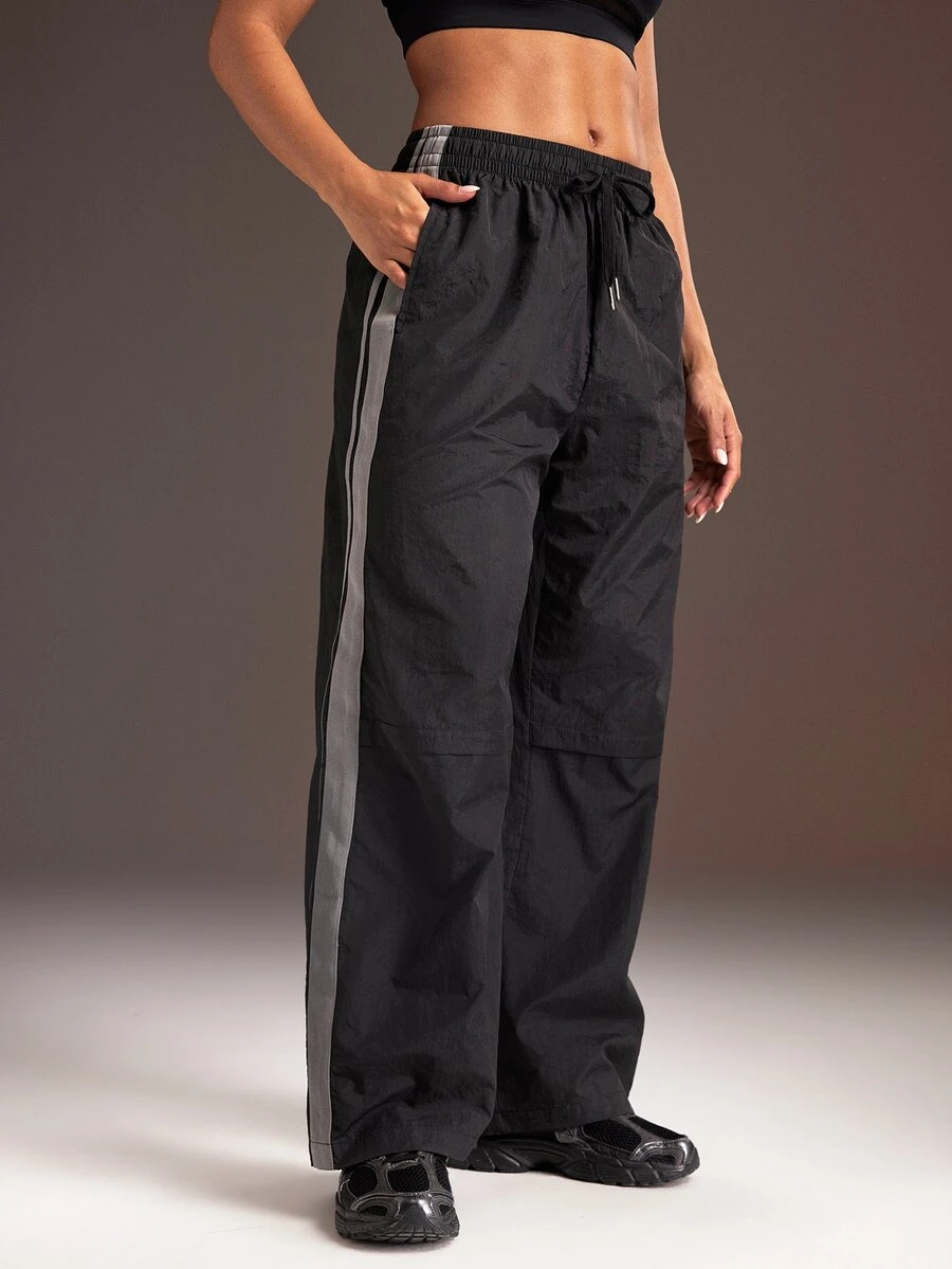 Powerista Women's Side Stripe Drawstring Waist Loose Fit Sports Long Pants - Black - View 1