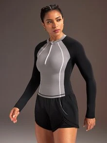 Powerista بلوزة رياضية نسائية بأكمام طويلة بتصميم راجلان وألوان متباينة مع سحاب وفتحة نصفية - الأسود - مشاهدة 4