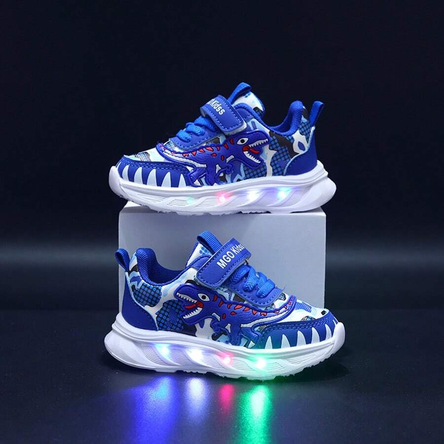 MGO Kidss Nuevos zapatos para niños otoño 2025 Zapatos deportivos con dinosaurio y luz LED, con parte superior para niños. Zapatillas con dinosaurio luminoso para niños de 1 a 6 años, primavera/otoño