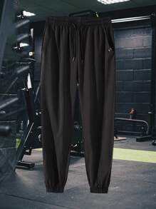 Pantalones deportivos para hombres con puños elásticos, tela ligera, transpirable y con caída y estiramiento, silueta que adelgaza y alarga las piernas, adecuado para deportes, ejercicio, correr, jugar a la pelota y vestimenta para ocio al aire libre