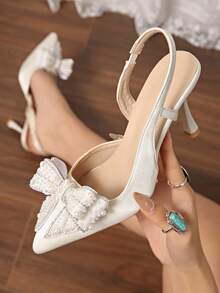 秋冬新款时尚女士高跟鞋，仿珍珠蝴蝶结玻璃杯鞋跟透明尖头，优雅派对鞋