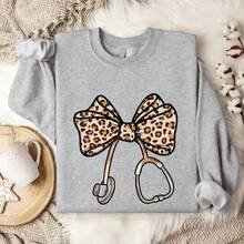 Leopard Nurse Coquette Bow Sweatshirt, Leopard Stethoscope Sweater, Graduation Gift For Nursing Student, Matching Nurse School. UA-1492 - Xám - Xem 1