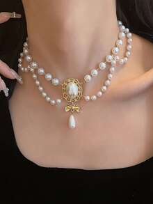 这款洛丽塔风格的复洛克仿珍珠流苏项链用途广泛，适合女士晚宴、舞会、婚礼及各种场合佩戴。它既是理想的装饰配饰，也是一条精美的项链。 - 白色 - 查看 3