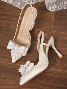 秋冬新款时尚女士高跟鞋，仿珍珠蝴蝶结玻璃杯鞋跟透明尖头，优雅派对鞋