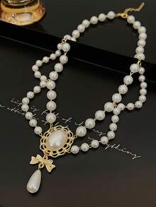 这款洛丽塔风格的复洛克仿珍珠流苏项链用途广泛，适合女士晚宴、舞会、婚礼及各种场合佩戴。它既是理想的装饰配饰，也是一条精美的项链。 - 白色 - 查看 5