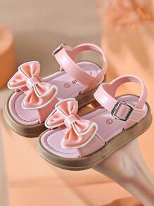 Un nuevo par de sandalias de niños con lazo para el verano, con suela suave antideslizante para interiores y exteriores, sandalias de princesa para la playa