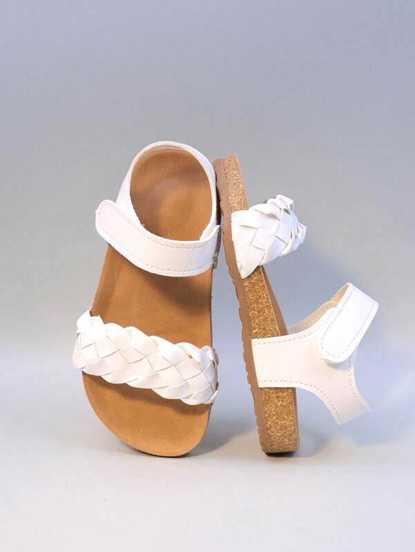 Sandalias de niña de verano 2025 de diseño con tira, estilo romano de punto, transpirables, protectoras del pie, suela de corcho ligera antideslizante