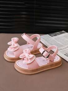 Un nuevo par de sandalias de niños con lazo para el verano, con suela suave antideslizante para interiores y exteriores, sandalias de princesa para la playa