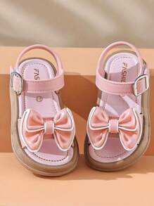 Un nuevo par de sandalias de niños con lazo para el verano, con suela suave antideslizante para interiores y exteriores, sandalias de princesa para la playa