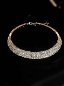 Tres fileiras strass dourada