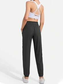 Women Lightweight Loose Sports Pants With Pockets, Suitable For Summer Exercise & Casual Wear, Stretchy Solid Color