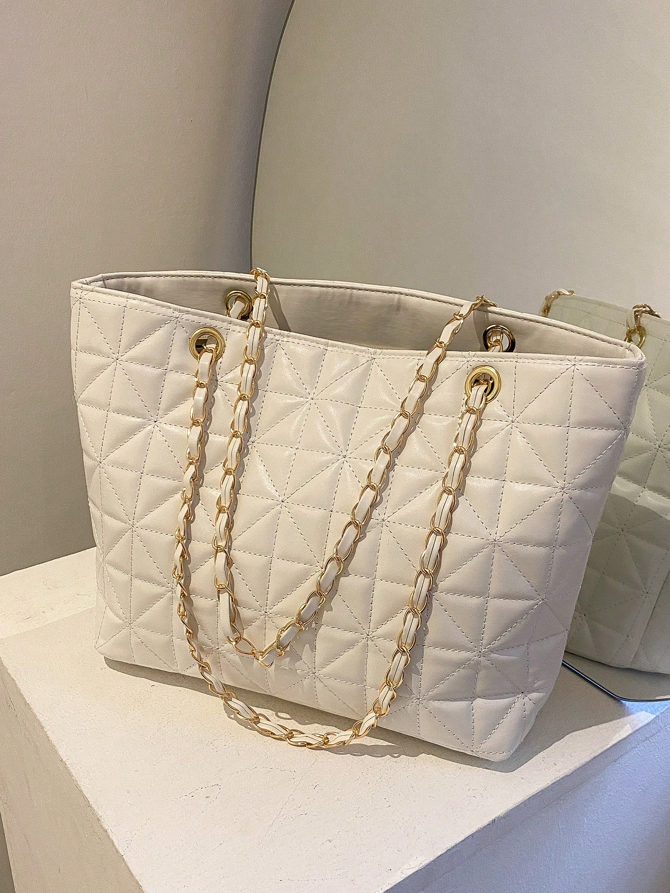 Quilted chain shoulder tote