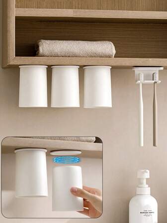 1 pièce Tasse à brosse à dents blanche simple et créative, absorption magnétique sans perçage, tasse de rinçage étanche suspendue, rangement de vanité de salle de bain, porte-brosse à dents, rangement de tasse à brosse à dents, tasse à brosse à dents pour couple, support de rangement à la maison, rangement dans le meuble de toilette