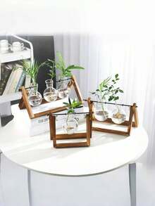 Bộ 3 bình hoa sáng tạo, khung gỗ và chất liệu kính, thích hợp cho cây trồng trong chậu, cây xanh và các loại cây thủy canh khác. Có thể sử dụng cho văn phòng, phòng khách, phòng ngủ, bàn làm việc, bàn ăn và các không gian trang trí nhà cửa khác. Cũng có thể dùng làm bình hoa, vật trang trí hoặc vật trang trí trung tâm. Trang trí bàn làm việc theo phong cách thủy canh cổ điển, thích hợp cho vườn nhà, trang trí văn phòng, trang trí phòng. Cũng có thể dùng làm quà tặng Ngày của Mẹ, quà sinh nhật hoặc quà tốt nghiệp. - Nhiều màu - Xem 4