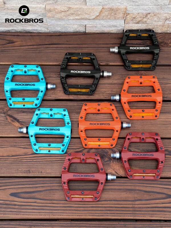 ROCKBROS Pedales de bicicleta de 4 colores intercambiables, diseño antideslizante en azul verdoso, negro, rojo y naranja