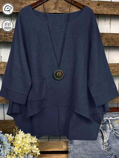 Camisa de mujer de un solo color con bolsillo y dobladillo asimétrico