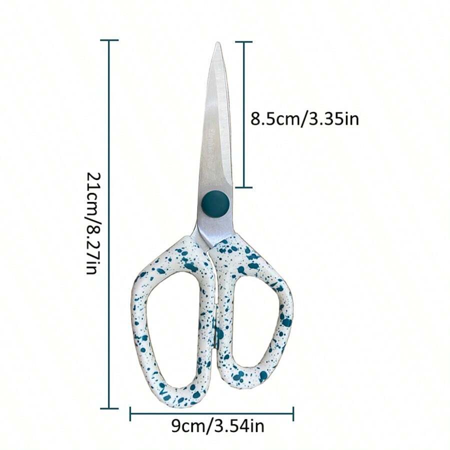 Una tijera portátil para el hogar. Es una tijera de acero inoxidable, de gran resistencia, con adornos punteados. Es una tijera multifuncional adecuada para cortar manualidades.