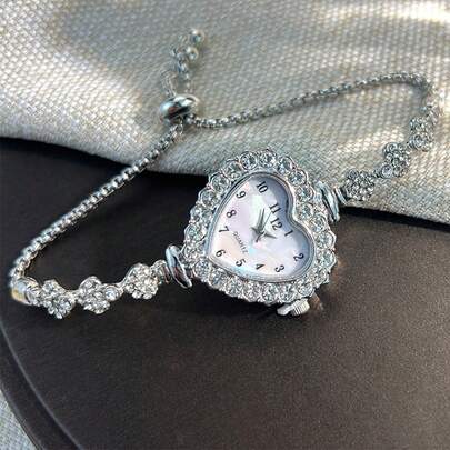 1 Đồng hồ thạch anh thời trang dành cho nữ có vỏ đính đá hình trái tim, mặt số Ả Rập và dây đeo kéo ra, tiện lợi và giản dị