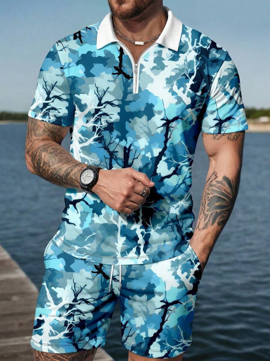 Bộ đồ nam gồm áo polo có khóa kéo in họa tiết cành cây và quần short thường ngày, phong cách nghỉ dưỡng. - Nhiều màu - Xem 1
