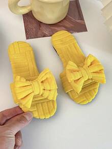 A Pair Of Summer Hot Kids' Non-Slip Slippers. The Upper Is Made Of Yellow Towel Material, With Checked Texture, And The Front Is Decorated With A Large Bow, Which Is Sweet And Lovely. Suitable For 3-12 Year Old Girls To Wear At Home, Comfortable And Can Add Children's Fun; Can Also Be Worn In Warmer Weather, Is Both Practical And Beautiful Fashion Items. - Yellow - View 4