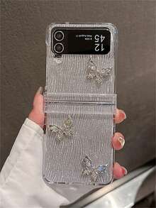 Ốp lưng điện thoại gập sang trọng hình bướm, đính đá 3D, hiệu ứng gợn sóng nước, kèm nơ trang trí, tương thích với Samsung Galaxy Z Flip 7, 6, Z Flip 5, Z Flip 4, Z Flip 3. Ốp bảo vệ mặt sau bằng nhựa PC trong suốt, cứng cáp, thích hợp làm quà tặng mùa xuân, tiệc tùng. - Cát lún lấp lánh - Xem 3