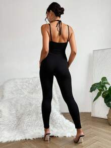 Mono jumpsuit legging ajustado sexy dama mujer tejido stretch tipo lycra tirantes delgados cruzados argollas metálicas decorativas bajo ajustado ideal salida fiesta noche evento festival primavera verano calor playa - Negro - Ver 4