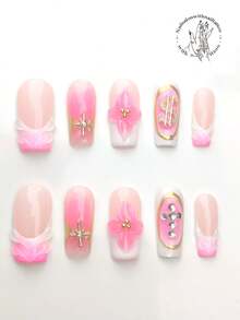 10 pezzi di unghie indossabili realizzate a mano, sfumatura rosa e bianco, fiori lavorati a mano con stami dorati a sfera, linee dorate ovali, decorazioni a forma di croce di strass, ornamenti dorati a forma di moneta, decorazione a rigonfiamento filettato. Stile primavera ed estate, adatto per il tempo libero quotidiano, le vacanze, camminare sul verde, partecipare a danze, banchetti, feste ed altre attività. Forniture per unghie