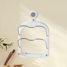 Support pour couvercles de casserole en plastique et fer avec pieds, adapté au rangement dans la cuisine et à l'organisation domestique quotidienne.