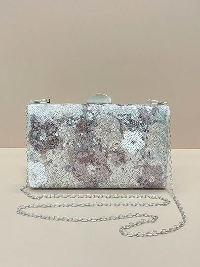 这款银色亮片斜挎包时尚优雅，饰以随机花卉刺绣，适合晚宴、舞会等场合，也可作为伴娘礼物。它时尚复古，采用链条设计，是派对女孩、新娘、大学生、年轻职业女性和上班族女性的理想之选。闪亮的亮片设计更添女性魅力。