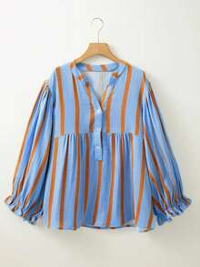 Nowa modna bluzka w kontrastowym kolorze z nadrukiem w paski, z falbaniastymi rękawami i długim rękawem