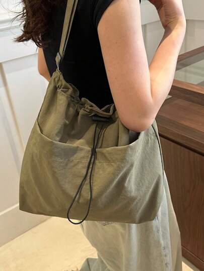 A Simple Bucket Shaped Crossbody Bag With Adjustable Shoulder Straps, Drawstring Closure, Special Nylon Material, Lightweight, Thin, Breathable Fabric, Solid Color, Suitable For Both Men And Women's Daytime Travel And Commuting