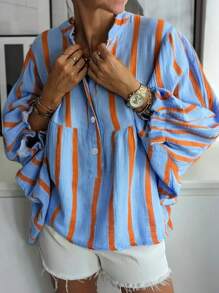 Nowa modna bluzka w kontrastowym kolorze z nadrukiem w paski, z falbaniastymi rękawami i długim rękawem