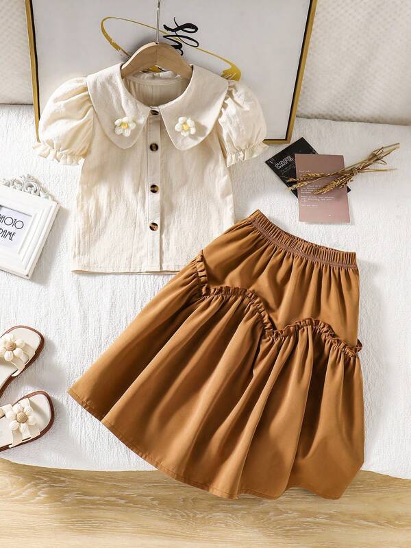 Vintage French Style Girl's Outfit Set. This Vintage French Style Set Includes A Beige Puff Sleeve Blouse And A Brown High-Waist Skirt. The Delicate Details And Elegant Style Are Suitable For Girls' Daily Wear, Travel, Photoshoot Or Artistic-Style Portraits. The Comfortable, Skin-Friendly Fabric Provides A Relaxed And Free Wearing Experience.