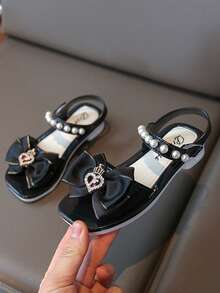 1双儿童凉鞋，女童蝴蝶结公主凉鞋，新款软底防滑儿童凉鞋，适合夏季的沙滩鞋，速干，魔术贴设计，时尚百搭，适合沙滩和户外活动，露趾款式 - 黑色 - 查看 1