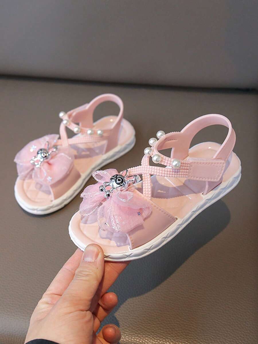1 đôi sandal đính đá nơ cho bé gái, giày công chúa thời trang đế mềm chống trượt hở mũi đi biển, thích hợp cho mùa hè - Hồng - Xem 1