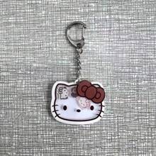 Sanrio 1 pieza Llavero con gatito de dibujos animados que se mueve, dije adorable de gato para mochilas y bolsos, regalo perfecto para cumpleaños, Pascua, accesorios adorables (estilo aleatorio)