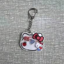 Sanrio 1 pieza Llavero con gatito de dibujos animados que se mueve, dije adorable de gato para mochilas y bolsos, regalo perfecto para cumpleaños, Pascua, accesorios adorables (estilo aleatorio)