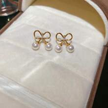 Andkiss 1 paire de boucles d'oreilles clous simples et élégantes en forme de nœud papillon, convient pour un port quotidien