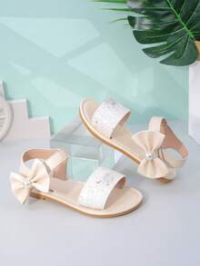 1 Paar kuschelige Pixies Gold Schleifenverzierte süße Prinzessinnenstil Flache Sandalen für Baby Mädchen & Kleinkinder für Frühling/Sommer