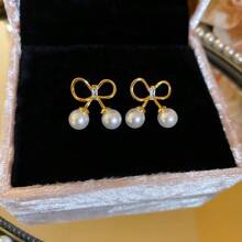 Andkiss 1 paire de boucles d'oreilles clous simples et élégantes en forme de nœud papillon, convient pour un port quotidien