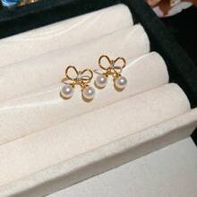 Andkiss 1 paire de boucles d'oreilles clous simples et élégantes en forme de nœud papillon, convient pour un port quotidien