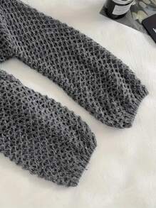 Pull lâche en tricot ajouré pour les vacances d'été