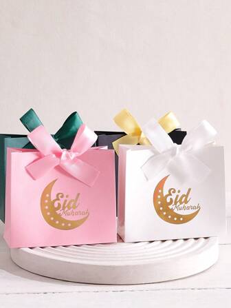 5 Eid Al-Adha Gift Boxes In Elegant Black, Luxurious Green And Pure White, Decorated With Beautiful Gold Star And Crescent Moon Motifs, Embellished With Luxurious Gold And Silver Ribbons, Perfect For Storing Sweets, Chocolates And Small Gifts, Made From Premium Materials, Perfect For Display On Special Occasions