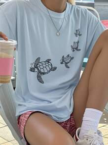 1 Peça Camiseta de Manga Curta com Gola Redonda e Estampa Gráfica Casual para Meninas, Vestuário para Estudantes e Geração Mais Jovem - Camiseta com Desenho de Tartaruga de Natação Artística Que Inspira a Imaginação e a Auto-Expressão
