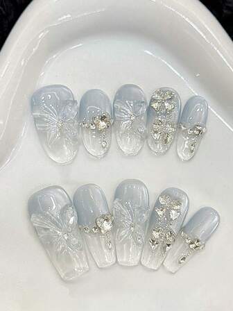 YADORNOS 10 件浅蓝色短椭圆形/长棺材手工按压指甲冰透明法式 3D 花朵蝴蝶凝胶设计，爆炸夏季简约蝴蝶水钻假指甲，包括 1 个果冻凝胶和 1 个指甲锉，适用于学校、音乐节派对美甲用品指甲