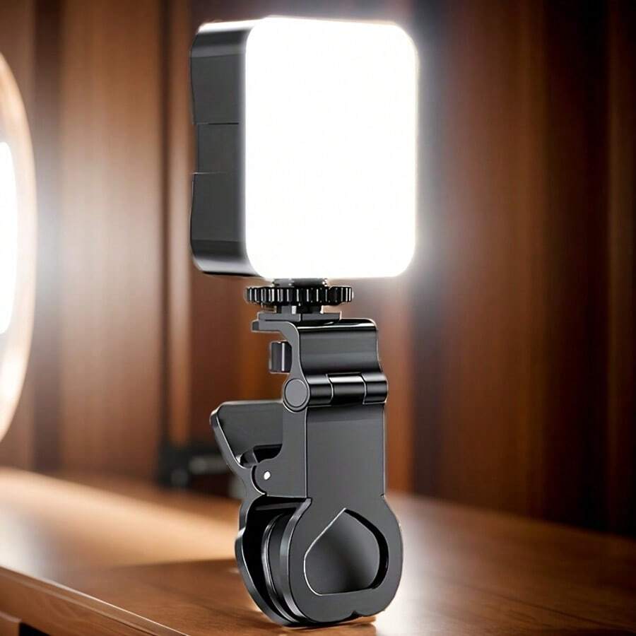 Un dispositivo de iluminación portátil con clip para teléfonos, portátiles y tabletas - Brillo ajustable para videoconferencias, transmisión en vivo, llamadas de Zoom, maquillaje y fotografía - Diseño compacto y elegante en negro con rotación de 180°, fabricado en material PP duradero