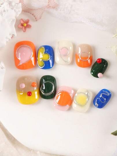 XEERCOOU 10Pcs Short Nails Colour Orange Yellow Green Blue Hand Drawn Flower Office Dailywear False Nails Includes 1Sheet Tabs &1 Pc Mini File Press On Nails Nail Supplies Nails