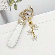 TTOBS 1pc Elegant Leather Key Chain With Lovely Flower Pendant - Durable, Fashionable And Multifunctional Keychain For Women - Variety Of Colors, Perfect Accessory And Gifting Idea For Car Owners