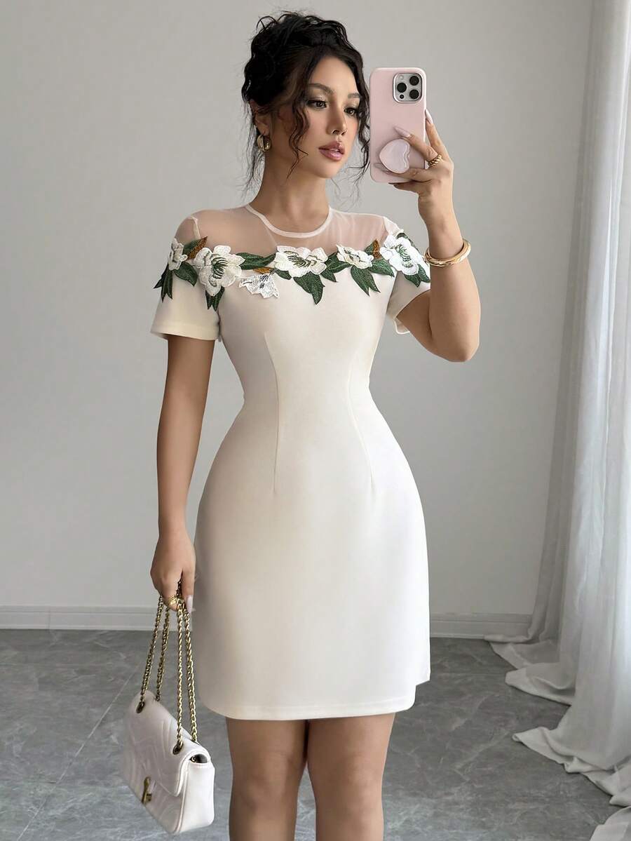 A Short, Form-Fitting Dress With A New Summer Cutout Collar And Embroidered Flowers